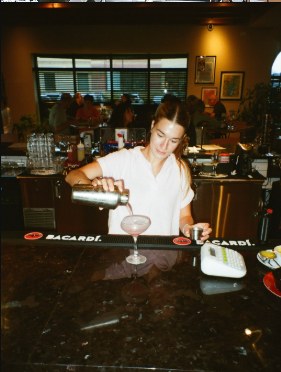 Pouring a cocktail at the bar